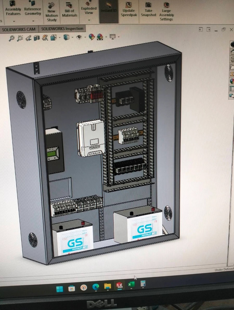 3D model of the control panel enclosure in SolidWorks, with batteries, charge controller, and DIN-rail components